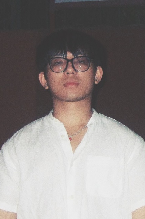 Yoihen Elangbam in a white shirt and glasses